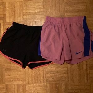 Pink Nike running shorts. Black UA running shorts